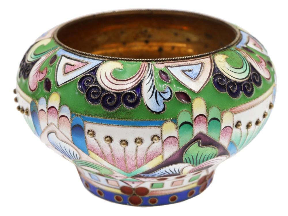 Decorative small metal salt cellar with painted enamel in green, white, blue, and purple and a rounded bowl form.