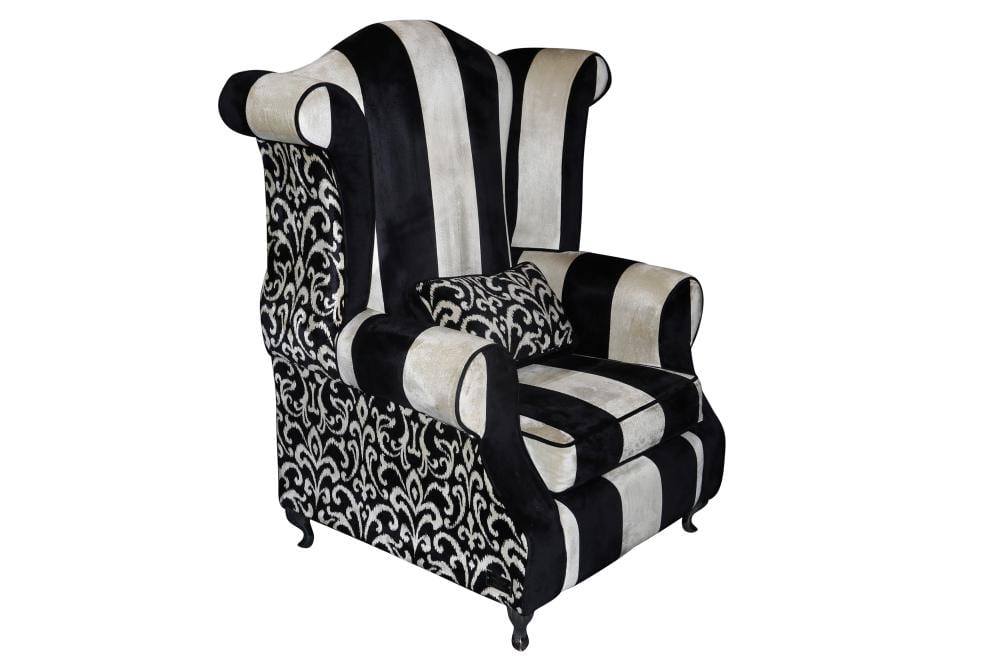 Richard James comparable auction result: a large contemporary mr mcqueen wing back armchair made by richard james
