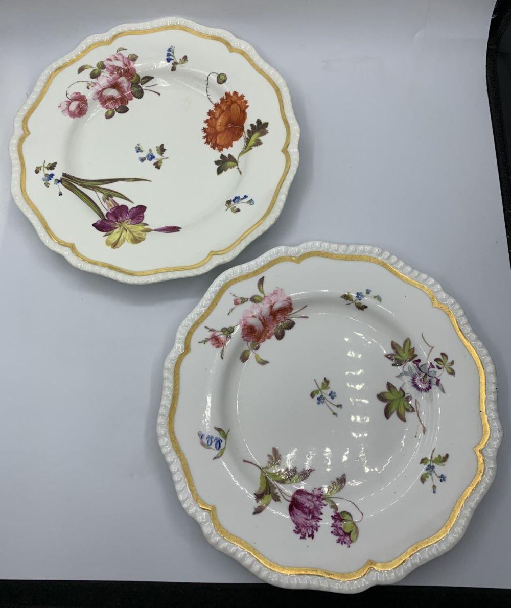 A. Daniel comparable auction result: a pair of h r daniel ribbed shape plates with floral design