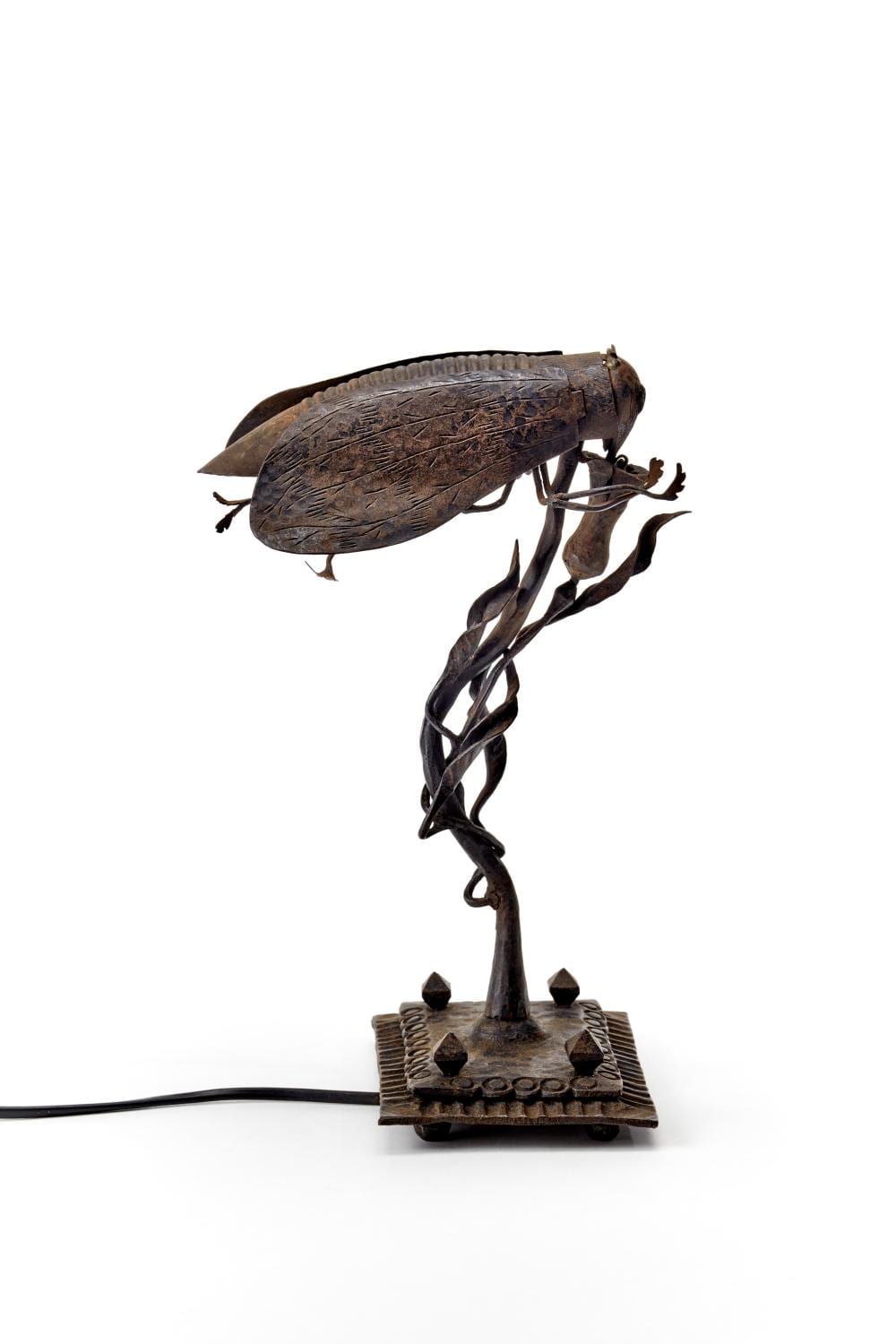 Alessandro Mazzucotelli comparable auction result: alessandro mazzucotelli attributed wrought iron table lamp depicting an insect landing on a flower italy early 20th century h 31 5 cm defects and losses
