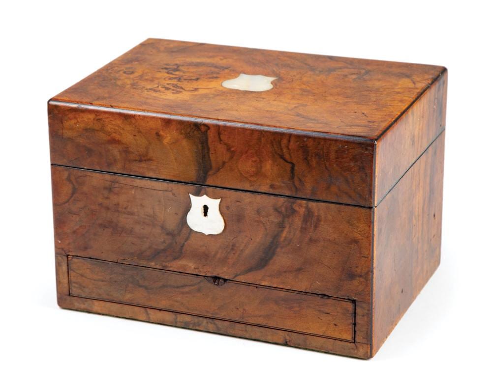 Antique-style wooden jewelry box with a hinged lid, two drawer fronts, and brass-colored keyhole escutcheons.