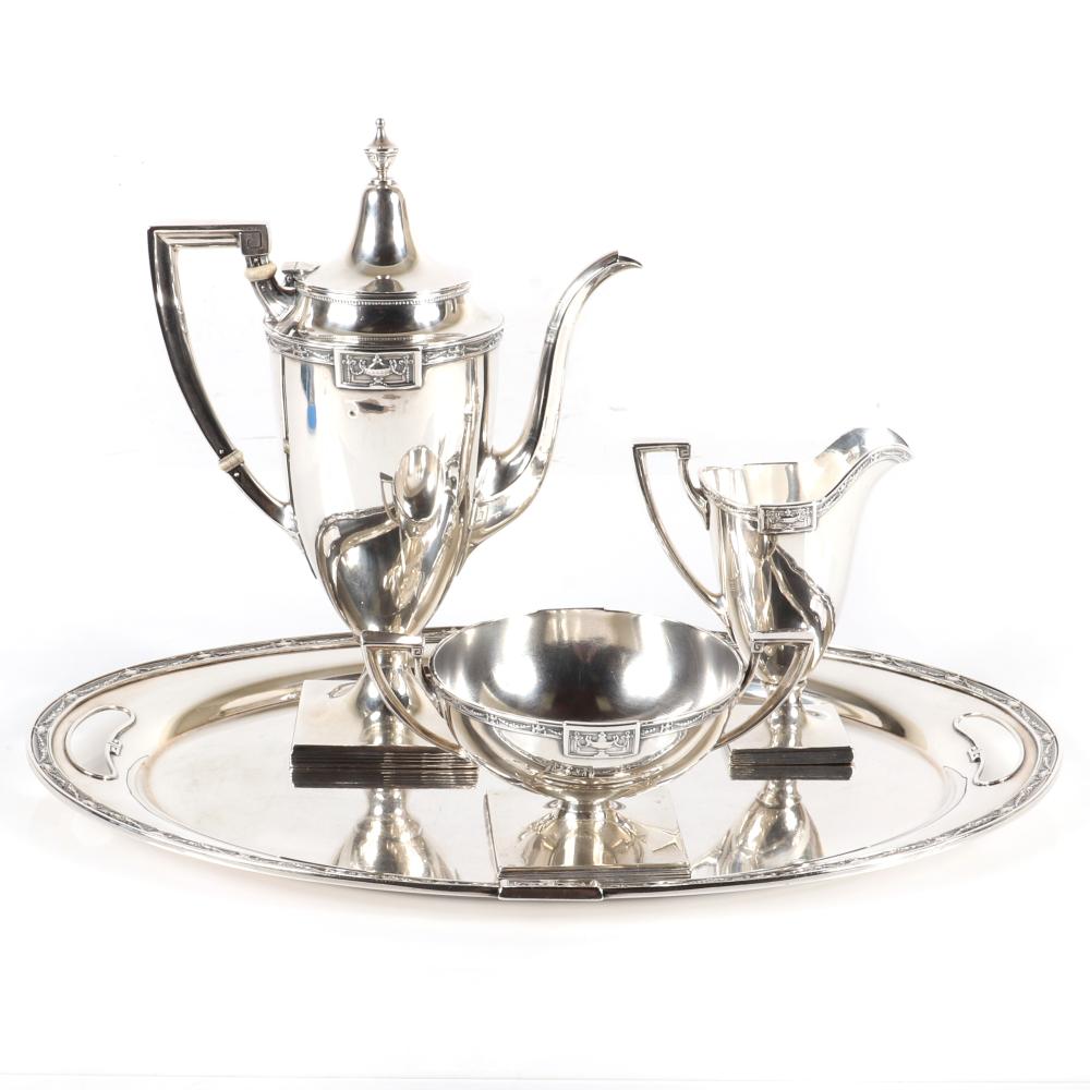 Auction comp thumbnail for Gorham Lansdowne sterling silver tea set with sterling silver tray. Three piece service consisting of teapot, cream pitcher and double handle sugar on round tray. 10"H (pitcher), 62.69 troy oz (Ripley Auctions, Lot 127)