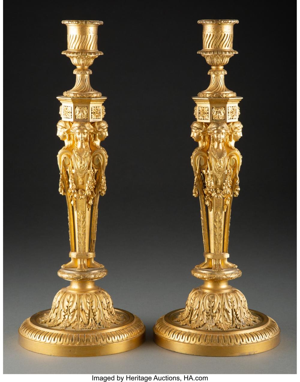 Antoine Guillemet comparable auction result: a fine pair of french louis xvi gilt bronze candlesticks after a design by jean