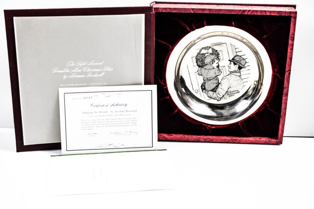 Round sterling silver collector plate with engraved Norman Rockwell-style figures, shown in a red velvet display case with included certificate documents.