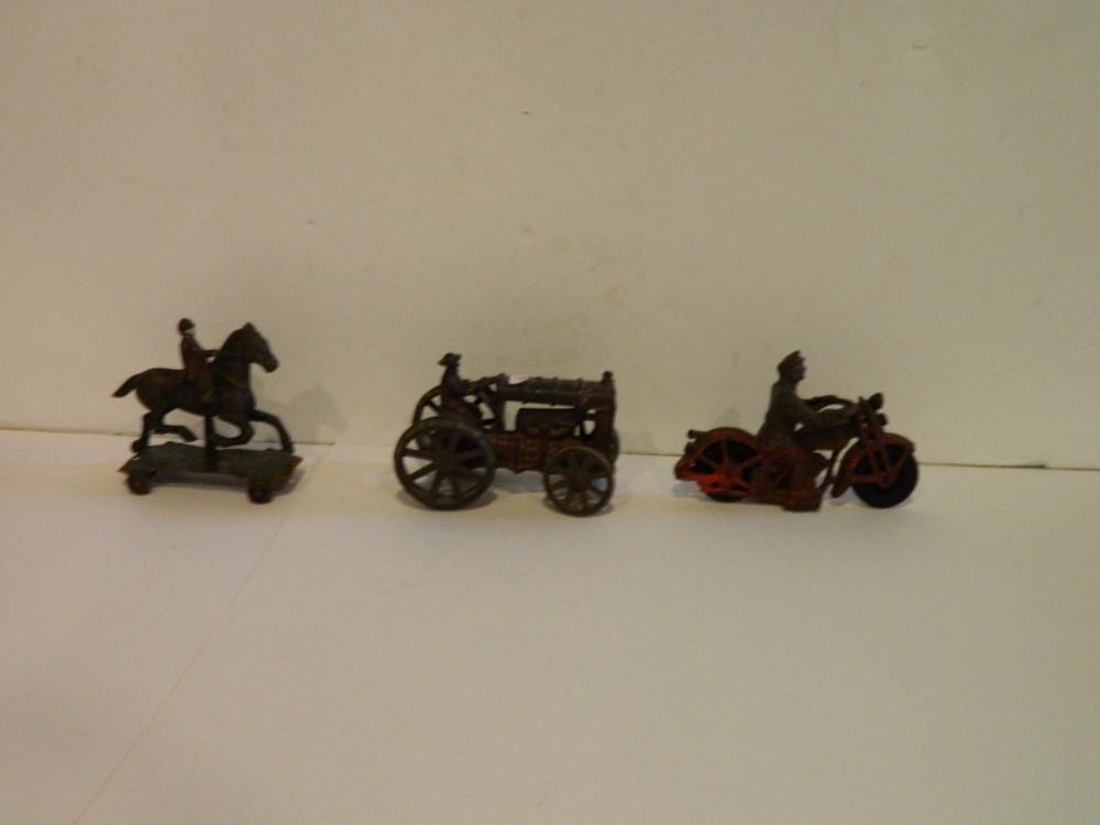THREE CAST IRON TOYS sold by Farrin's country Auctions, lot 554 — auction record photograph