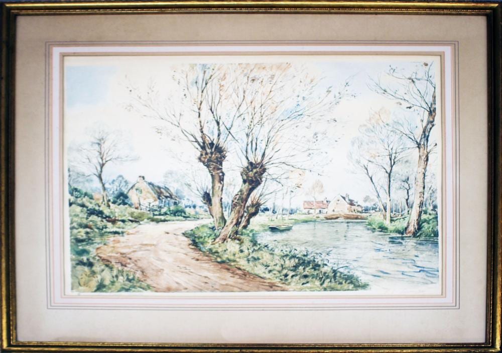 Framed colored print showing a riverside landscape with bare willow trees and a small boat on the water