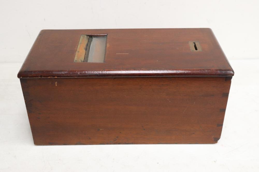 Brown wooden cash register with a hinged top and metal interior insert, shown from the front on a white background.