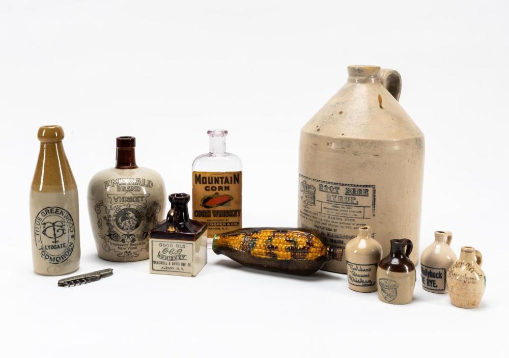 11 ASST. MAINLY WHISKEY ADVERTISING JUGS & BARWARE sold by Ahlers & Ogletree Inc., lot 1319 — auction record photograph