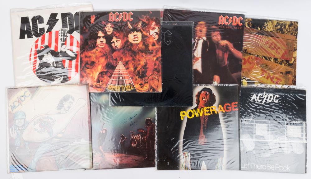 AC/DC: complete run of 1975-1980 albums on vinyl comprising "High Voltage", "T.N.T.", "Dirty Deeds Done Dirt Cheap", "Let There Be Rock" (2, different pressings/sleeves, one signed on front by Angus Young), "Powerage", "If You Want Blood", "Highway sold by Leski Auctions Pty Ltd, lot 1443 — auction record photograph