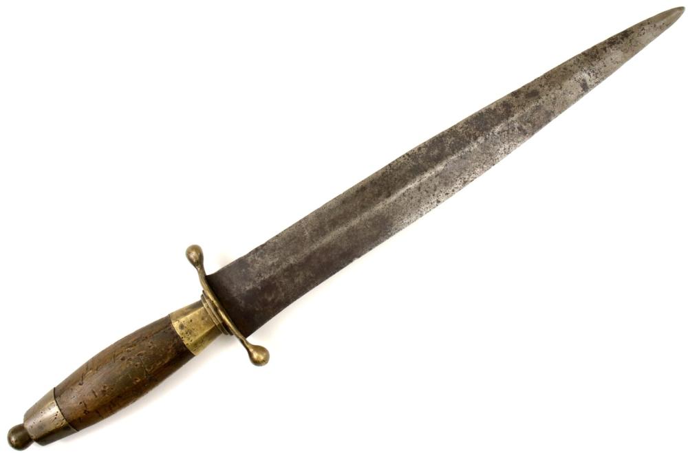 Close-up of a metal fighting dagger with a pointed blade and gold-toned crossguard and pommel, shown on a white background.