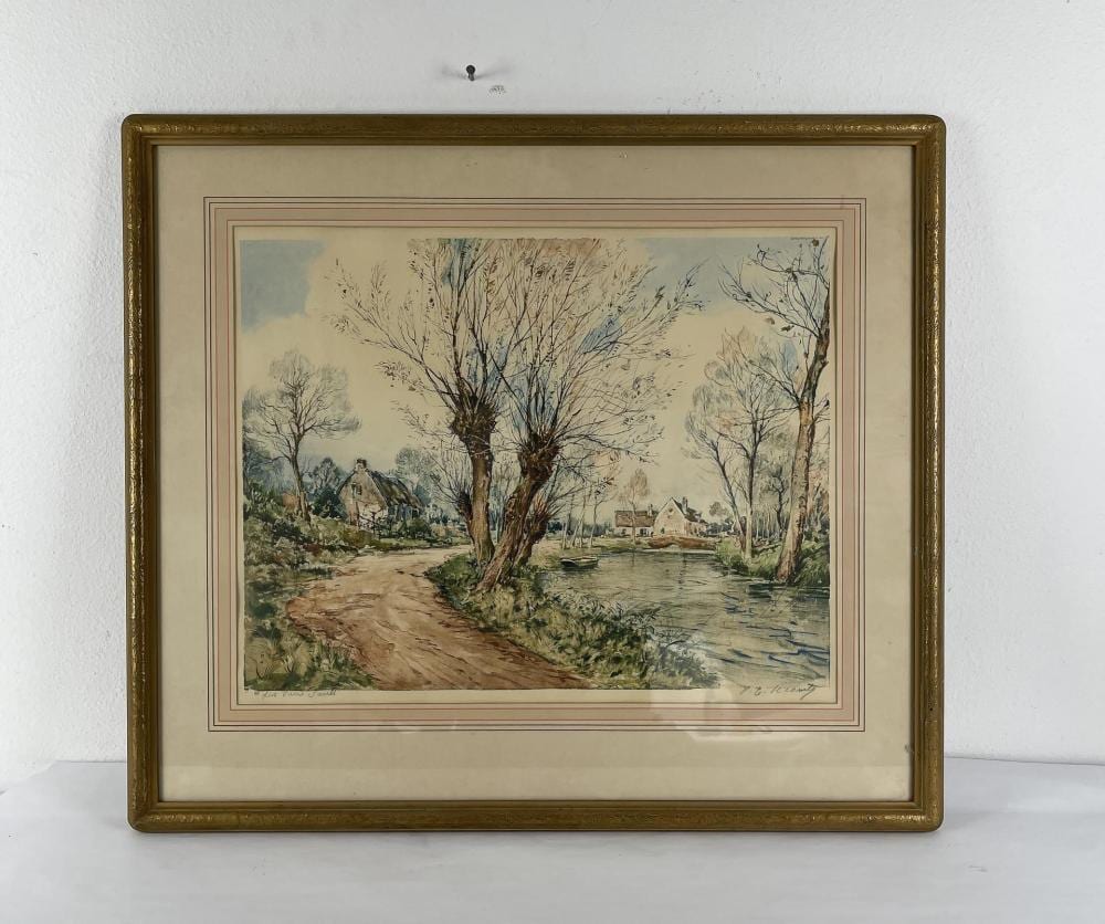 Framed landscape etching showing a river or canal with willow-like trees and a rural village scene in the distance.