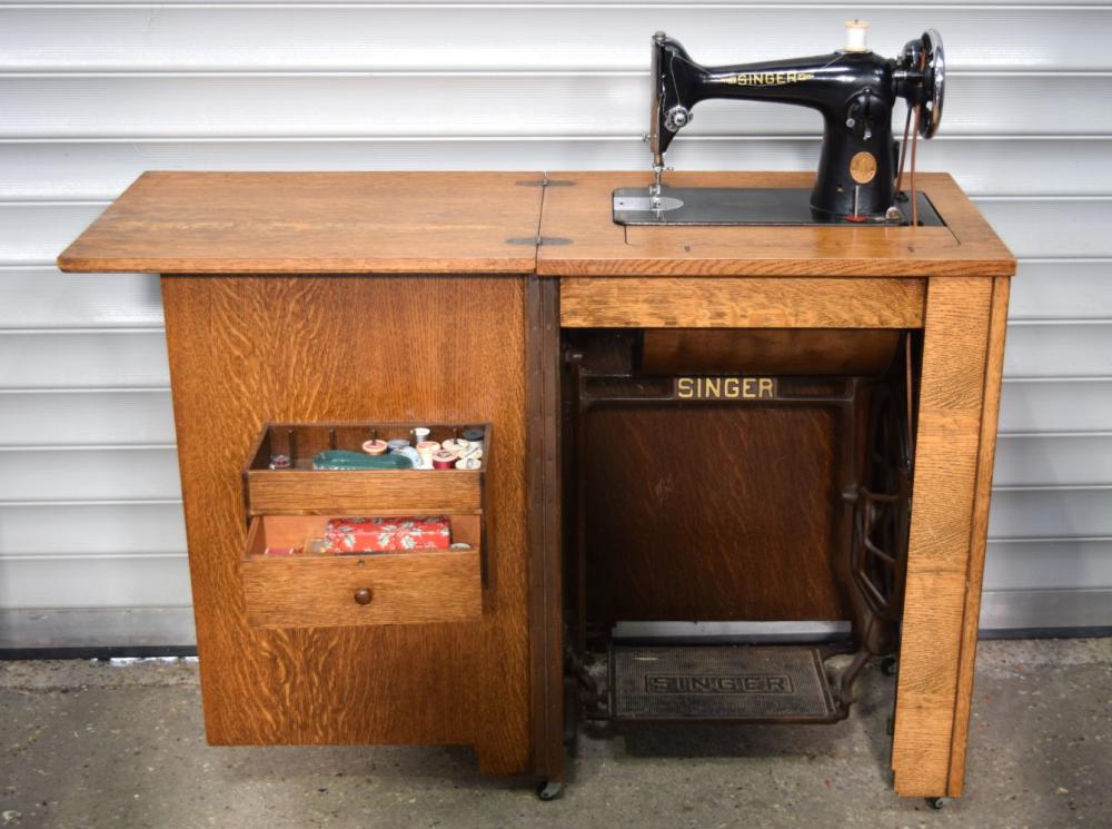 A mid century Singer sewing machine cabinet with integral sewing machine 83 x 57 x 42 cm. sold by Hannam's Auctioneers, lot 3305 — auction record photograph