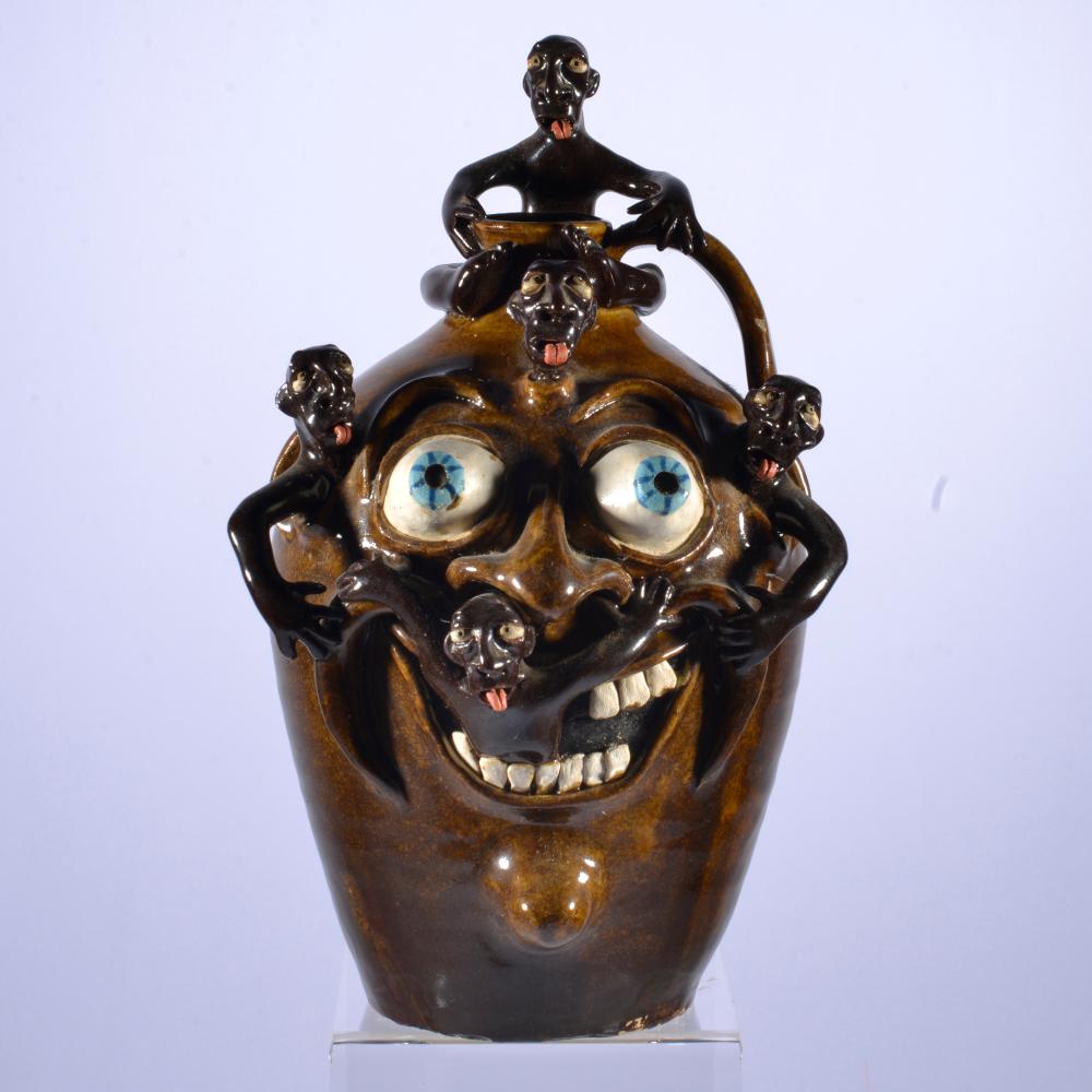 Stacy Lambert comparable auction result: stacy lambert 1 9 inch jug multi figural face jug