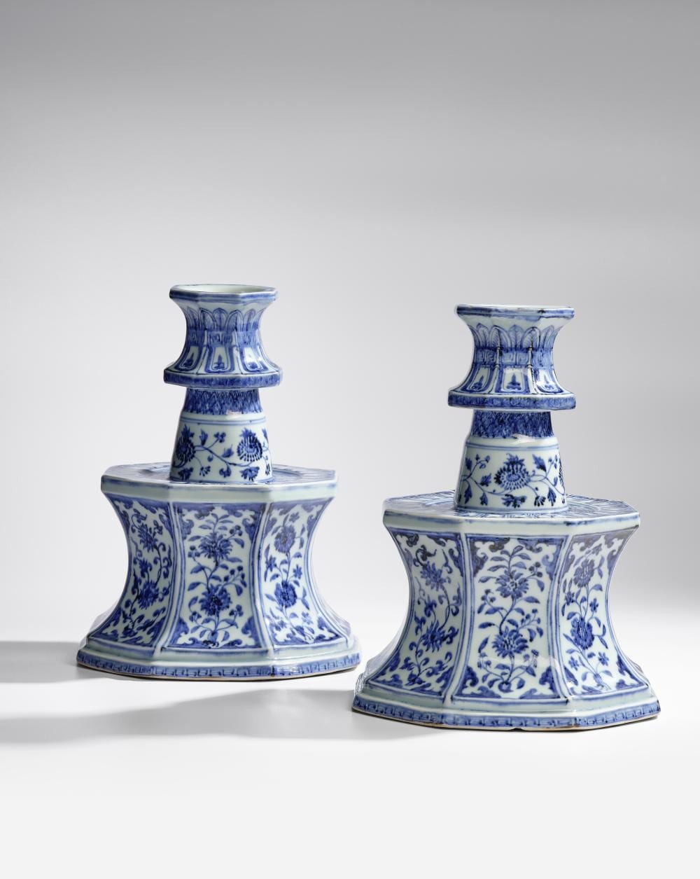 AN EXCEPTIONALLY RARE AND IMPORTANT PAIR OF BLUE AND WHITE OCTAGONAL CANDLESTICKS Yongle (2) comparable sale