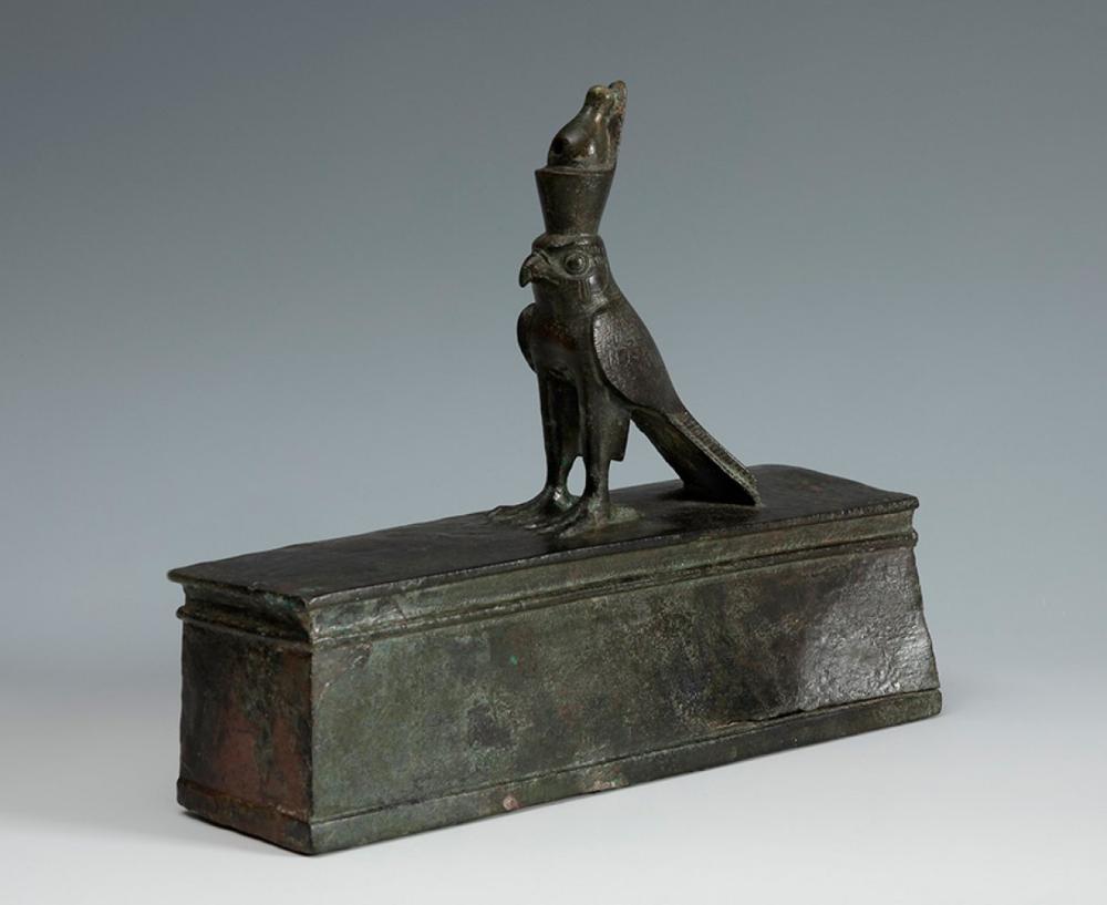Horus on a sarcophagus of a falcon. Ancient Egypt, Lower Epoch, Dynasty XXVI, 664 ? 525 B.C. Bronze Provenance: - Adam A. Weschler & Son, auction of February 27, 1971. - Private collection, Maryland (USA), from 1971. sold by Setdart Auction House, lot 83 — auction record photograph
