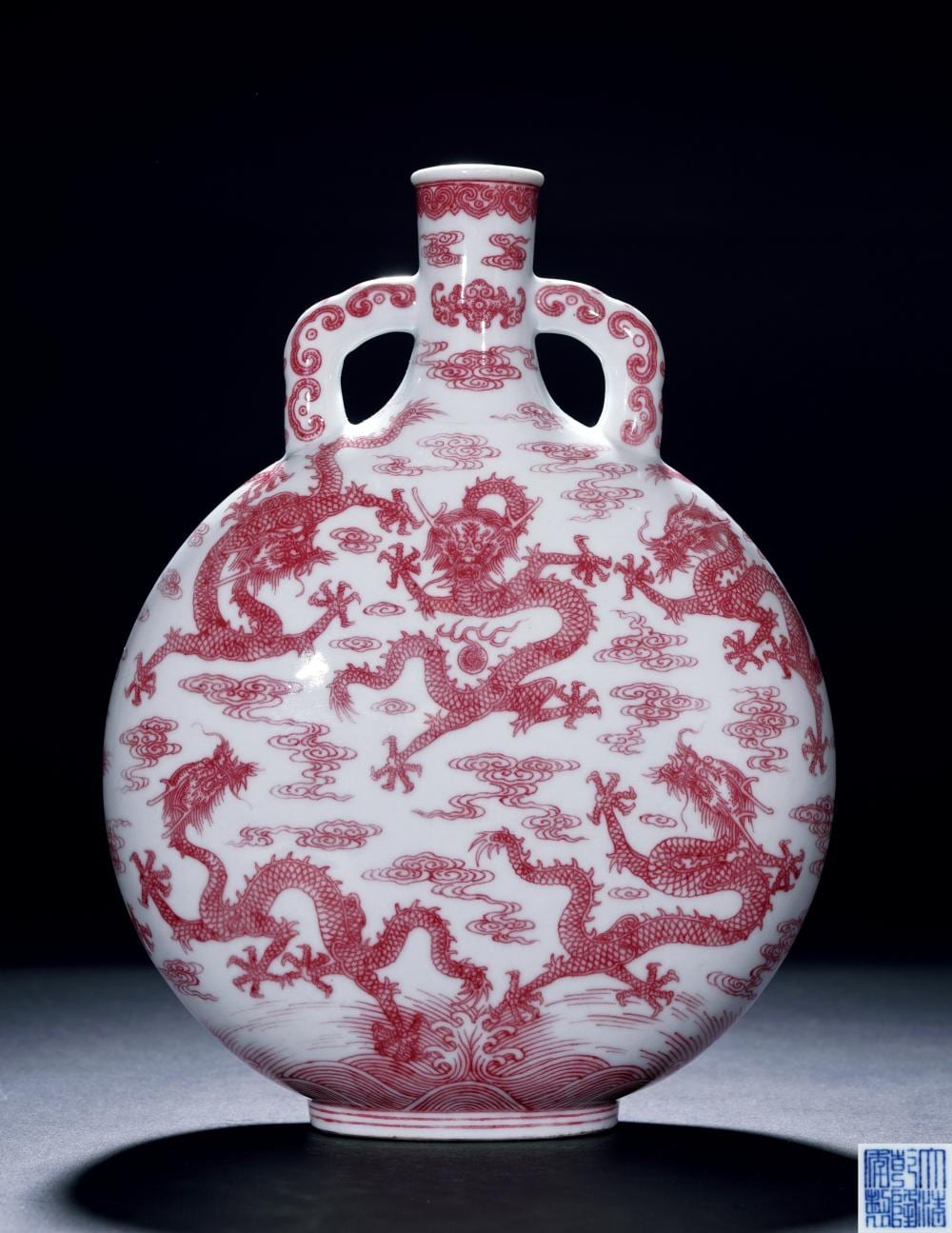 An Extremely Rare Copper-Red Decorated 'Nine Dragons' Moonflask, SEAL MARK AND PERIOD OF QIANLONG 清乾隆 釉裡紅九龍圖抱月瓶 comparable sale