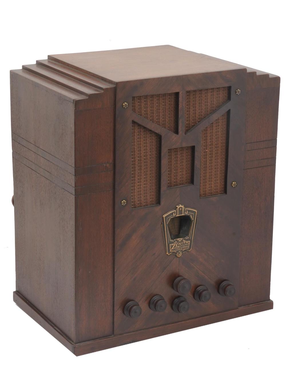 Wooden Zenith tombstone-style radio with four round knobs on the front and a speaker grille panel shaped like a cross.