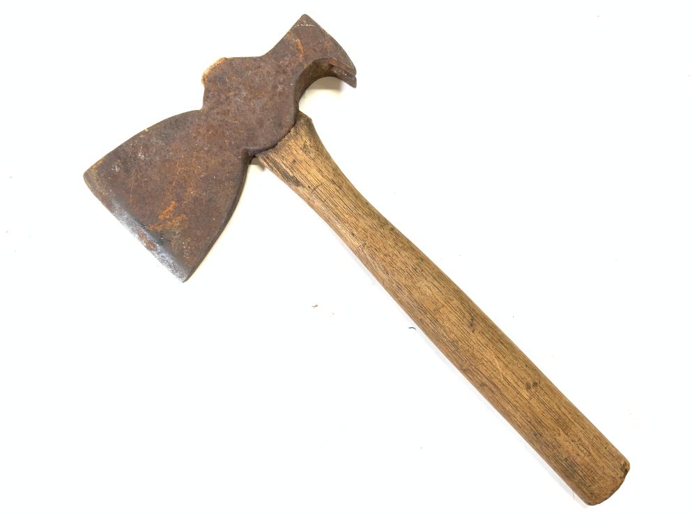Antique-style axe with a rusted metal head and a wooden handle shown on a white background.