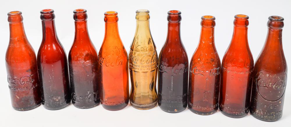 AMBER COKE BOTTLES, 9 [155100] sold by Holabird Western Americana, lot 3492 — auction record photograph