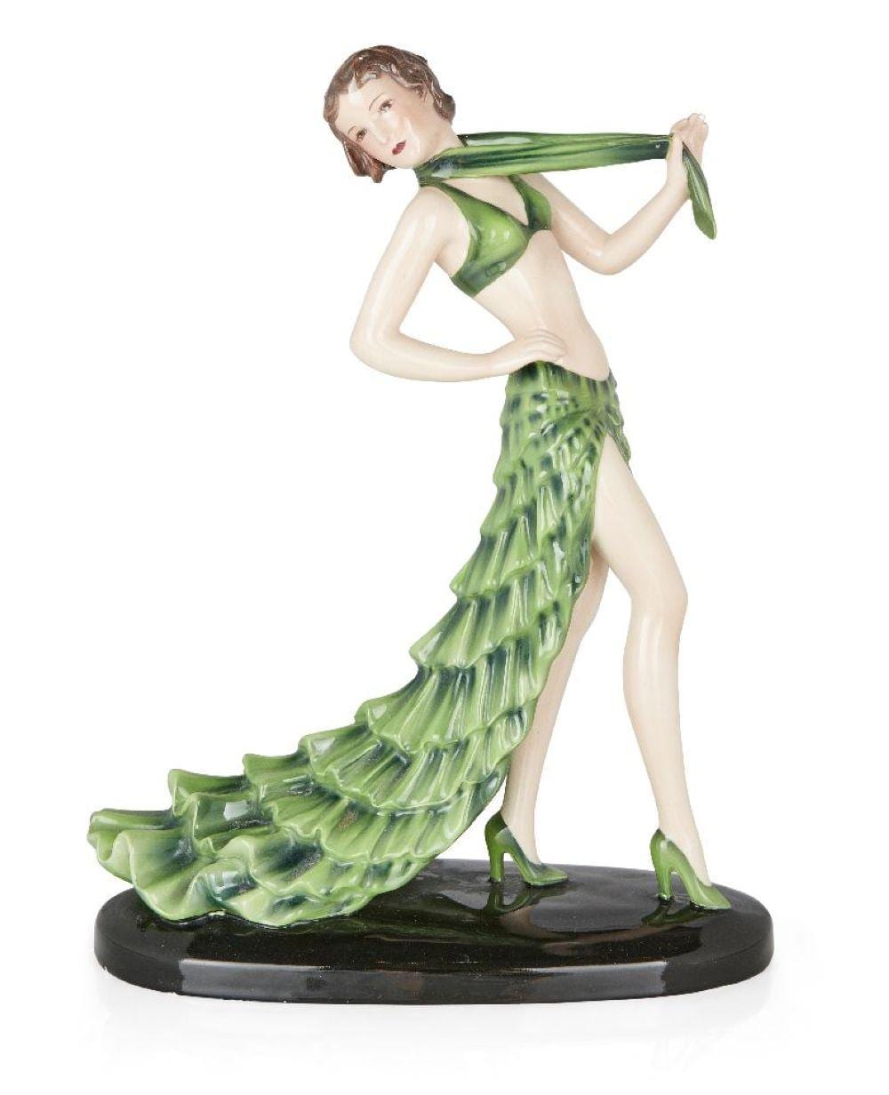 Stephan Dakon comparable auction result: stefan dakon 1904 1992 for goldscheider rumba model of female dancer in green skirt and sca