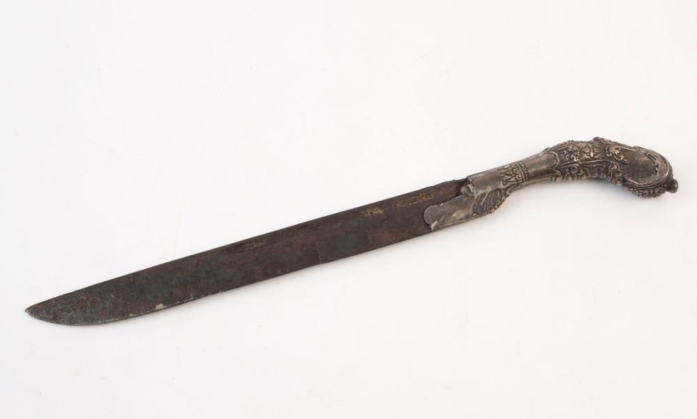 Antique-style dagger shown in profile with a dark metal blade and an ornate, engraved handle capped with a round pommel.
