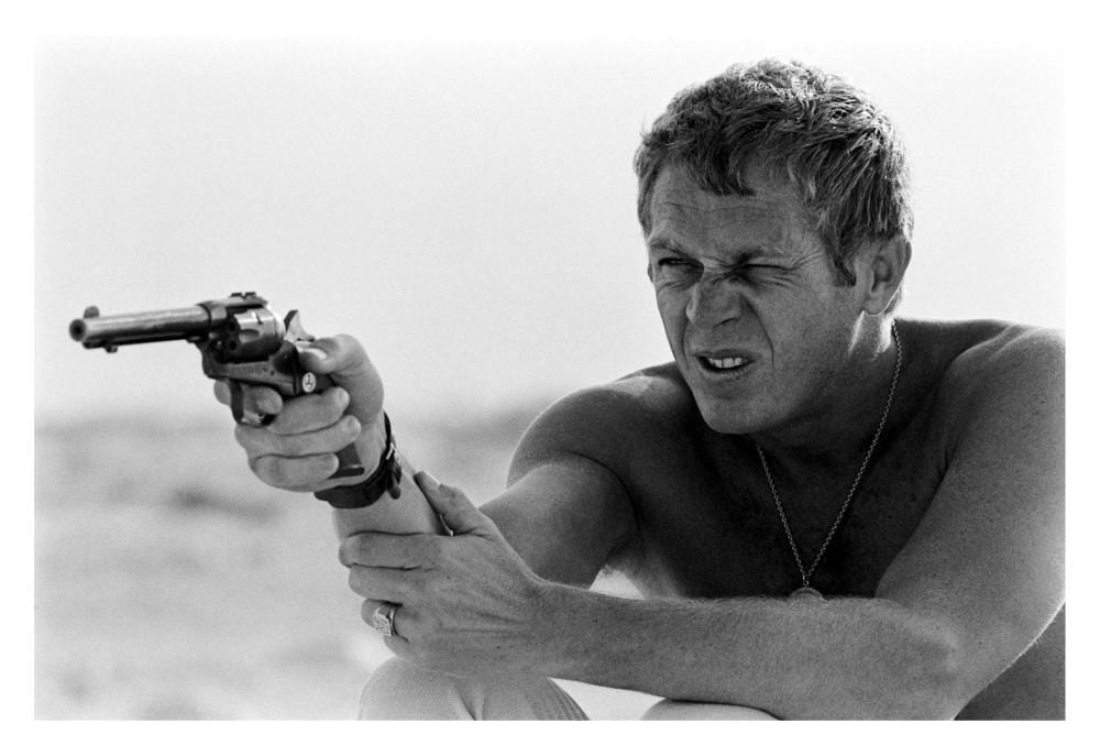 John Dominis comparable auction result: john dominis 1921 2013 l acteur steve mcqueen visant avec un pistolet