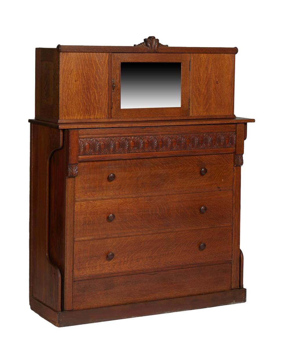 American Carved Oak Murphy Bed, early 20th c., with a mirror door cupboard over a fold out faux drawer chest, enclosing a mattress, ... sold by Crescent City Auction Gallery, lot 1089 — auction record photograph