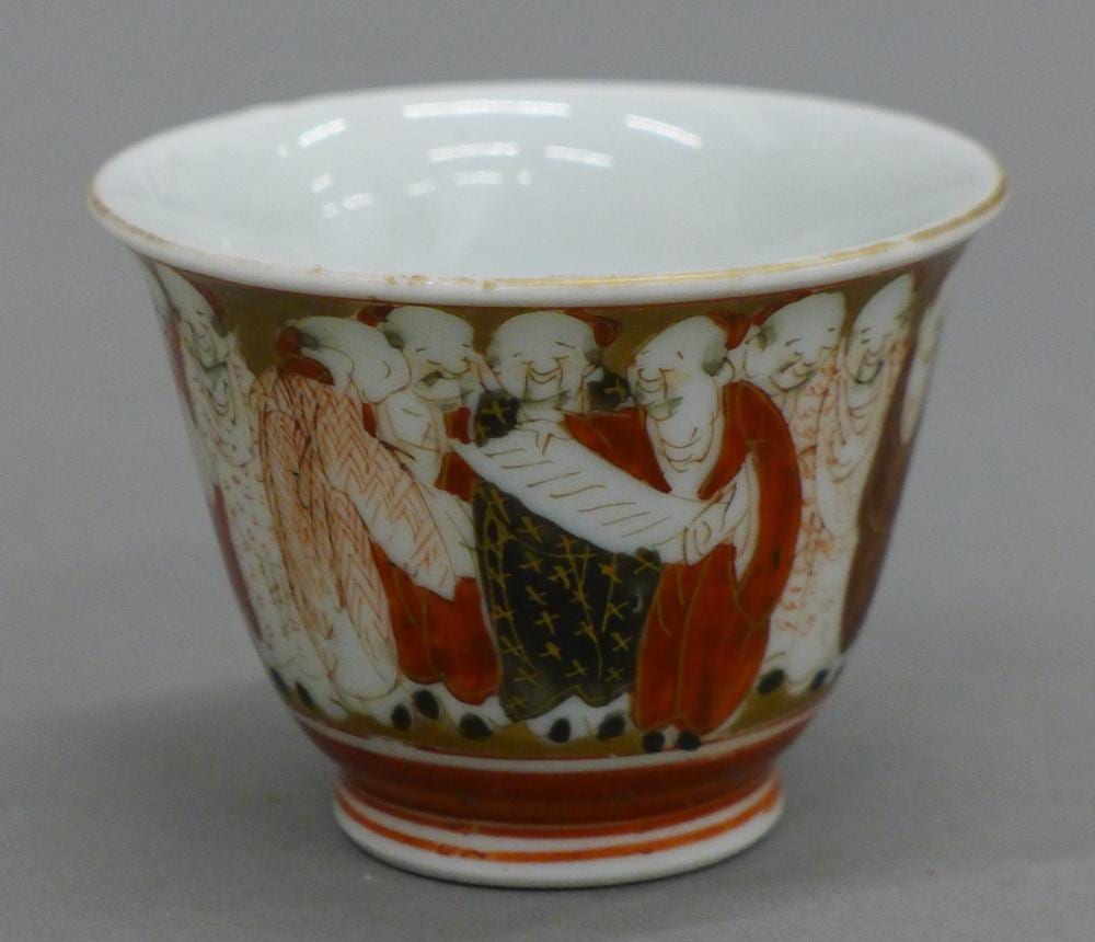 A signed Kutani sake cup decorated with scholars. 4 cm high. sold by Rowley Fine Art Auctioneers and Valuers, lot 687 — auction record photograph