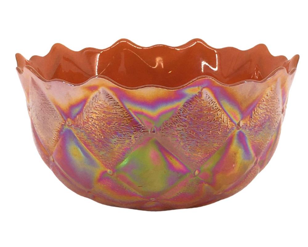 Colorful iridescent glass bowl with scalloped, wavy rim and a marbled purple, yellow, and orange surface.