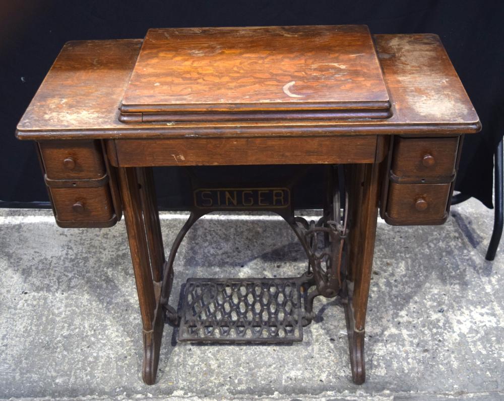 A vintage Singer sewing machine table with cast iron treadle 77 x 87 x 40 cm sold by Hannam's Auctioneers, lot 3503 — auction record photograph