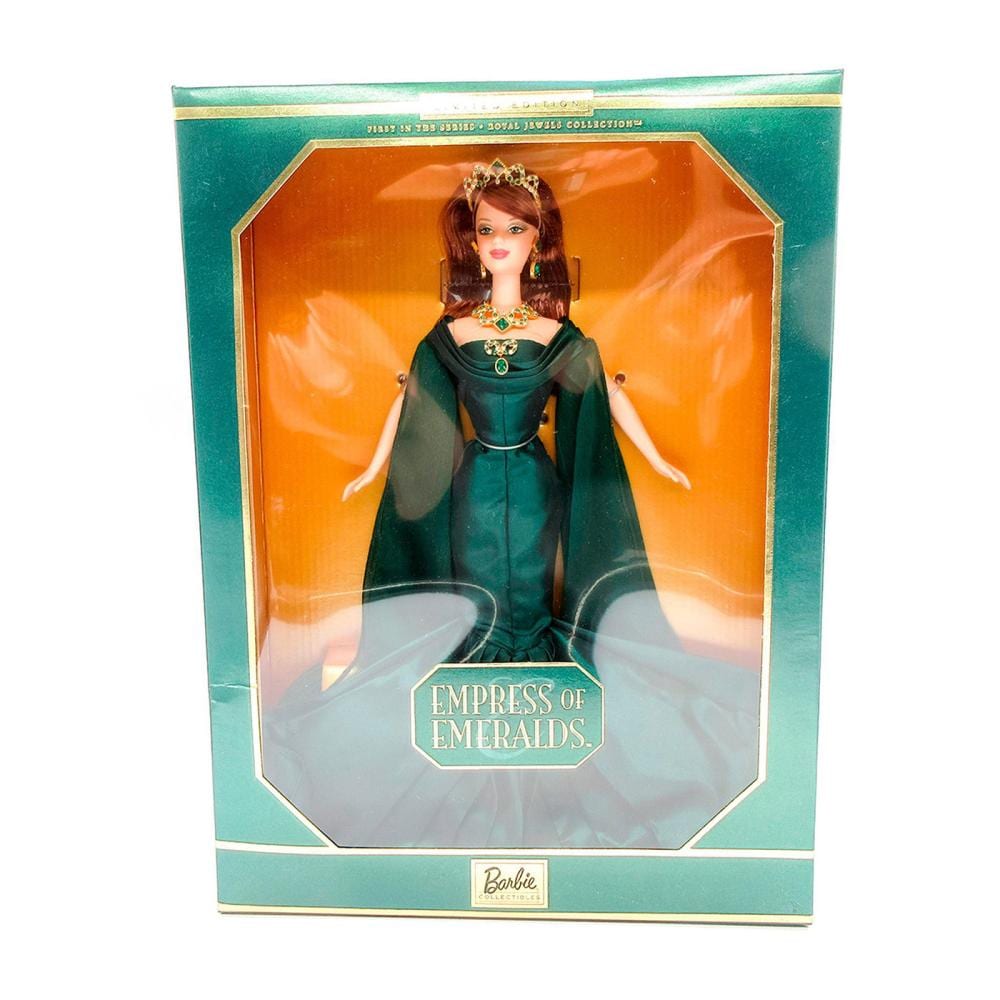 Barbie doll in a green jeweled outfit and cape displayed in a teal retail box labeled “Empress of Emeralds.”