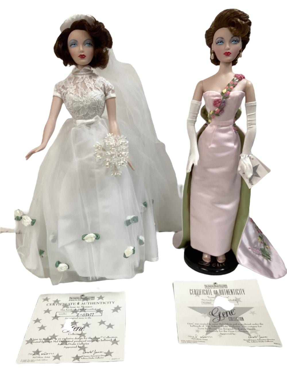 Pair of 16" The Ashton-Drake Galleries, Mel Odom, Gene Marshall doll "Love In Bloom" and "Gene In Monaco." NIB, COA's. sold by Apple Tree Auction Center, lot 1764 — auction record photograph