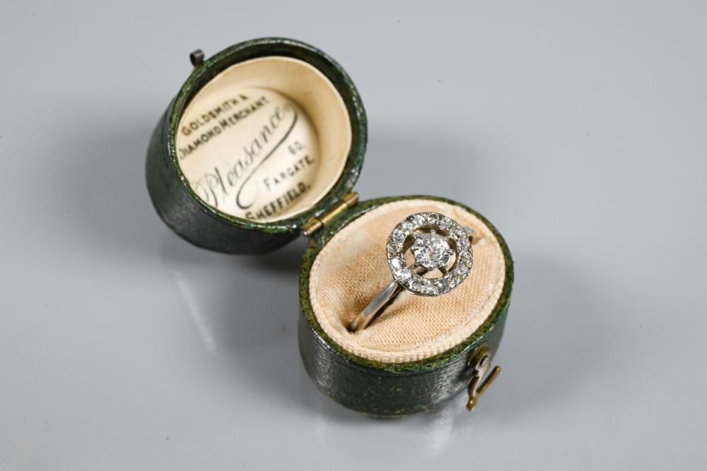 D. Ring comparable auction result: an antique diamond floating halo cluster ring formed of a central old cut d
