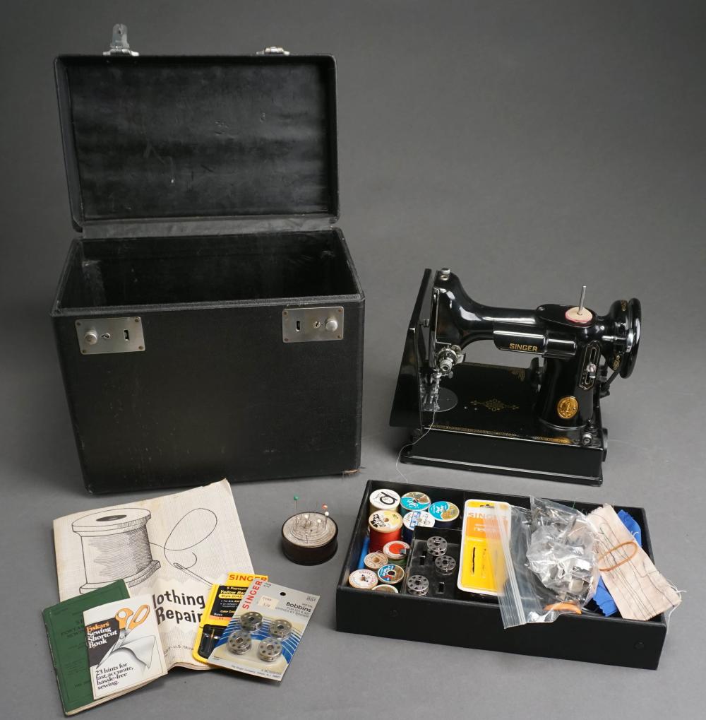 Auction comp thumbnail for Singer Featherweight Sewing Machine and Accessories in Case (Weschler's, Lot 432)