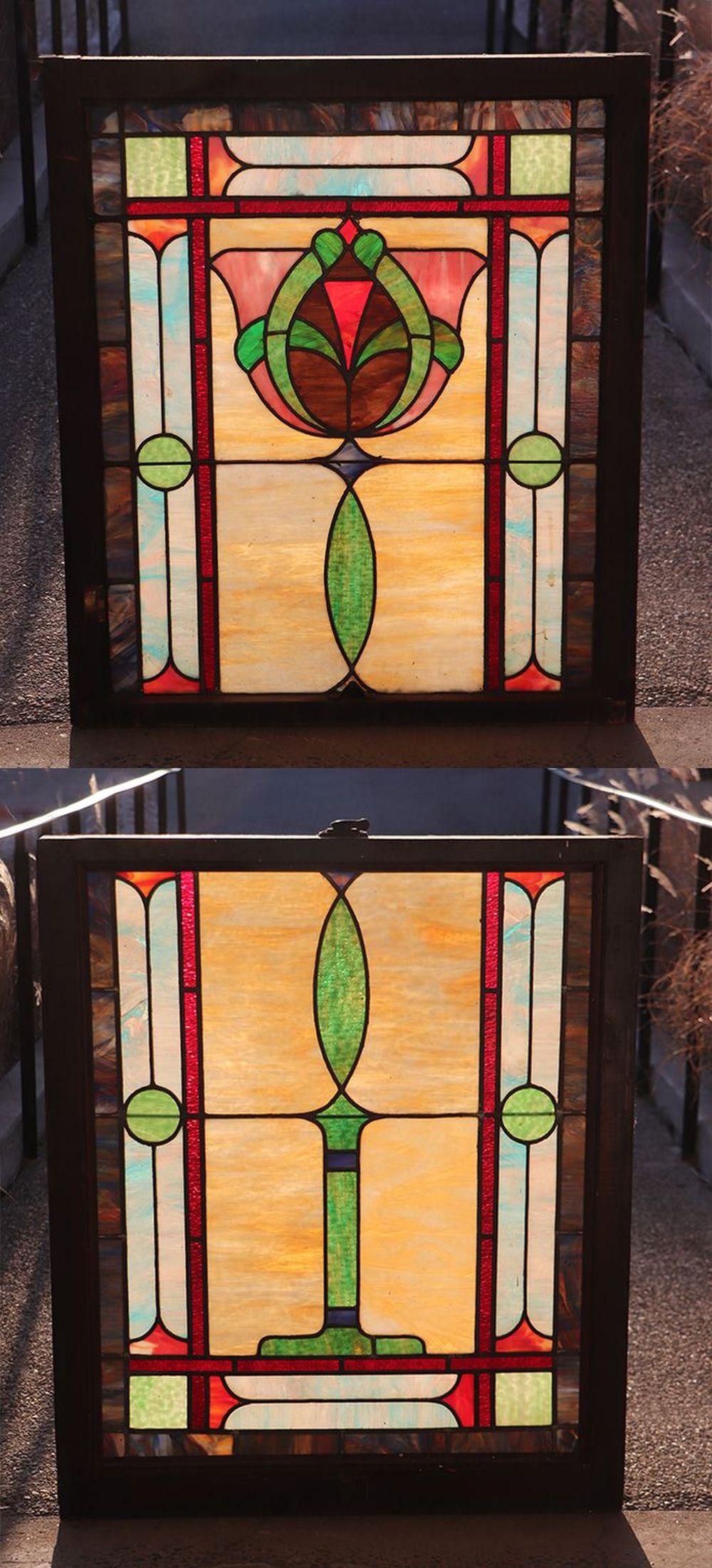 Two views of a rectangular stained glass window panel with red, green, blue, and amber glass pieces framed in dark metal and joined by lead lines.