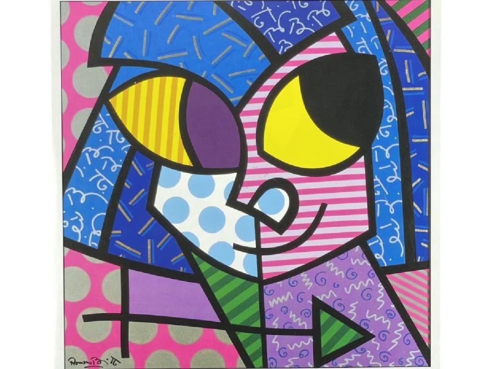 Colorful graphic print of a stylized face with yellow eyes, blue hair, and patterned shapes.