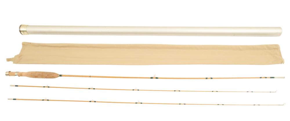 Two-piece split bamboo fly fishing rod set with rod sections and tan protective cloth sleeve, shown side by side on a white background.
