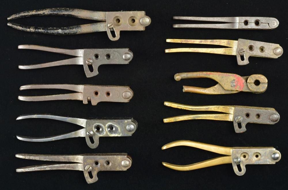 10 ANTIQUE STYLE BULLET & BALL MOLDS. sold by Poulin Antiques & Auctions, lot 1621 — auction record photograph