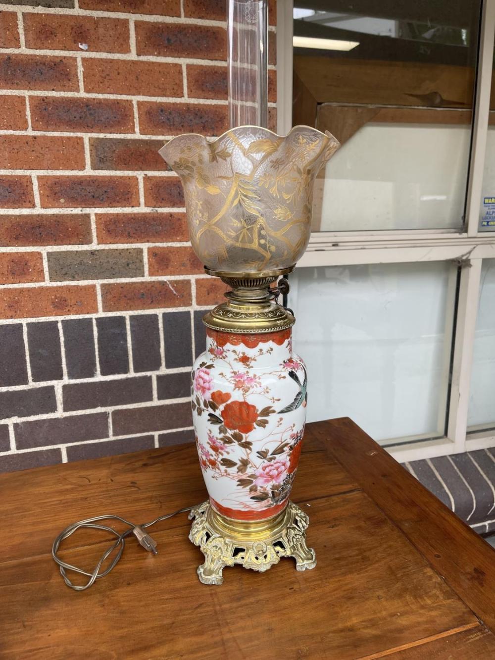 Auction comp thumbnail for Antique Japanese Kutani vase oil lamp, converted to electric light at the top only, with fine hand gilt shade, approx 66cm H (Vickers & Hoad, Lot 256)
