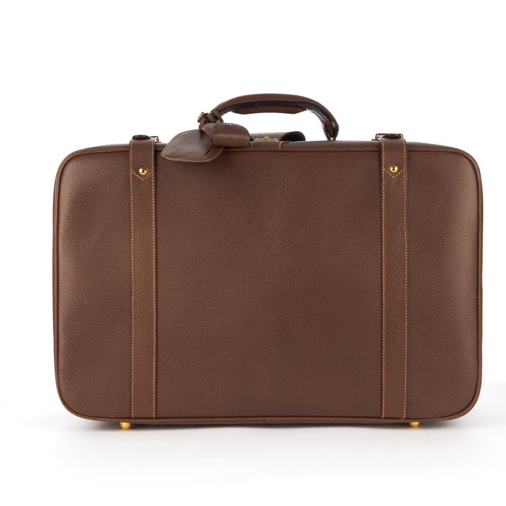 Brown leather vintage suitcase with top handle, front latch tab, and two side leather straps on a white background.