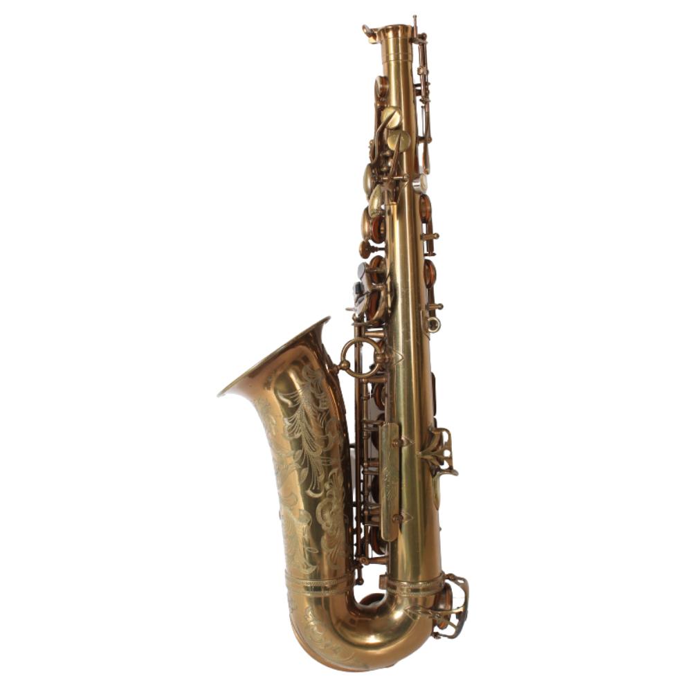 Brass saxophone with engraved bell and open keywork, photographed against a white background.
