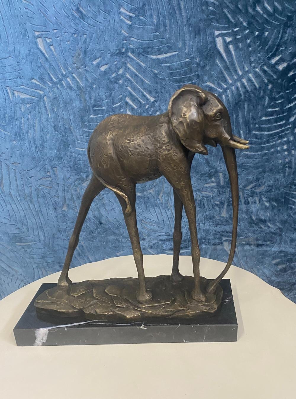 Salvador Dali Inspired Bronze Sculpture - The Elephant. On Marble Base. Signed. Measures 36cm x 31cm x 12cm. sold by Pottle Auctions, lot 502 — auction record photograph