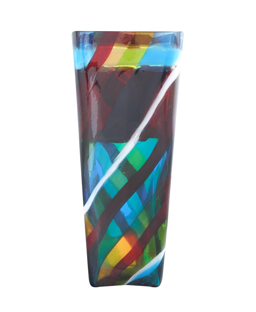 Colorful abstract Murano-style glass vase with multicolored geometric pattern and a sweeping white diagonal stripe.