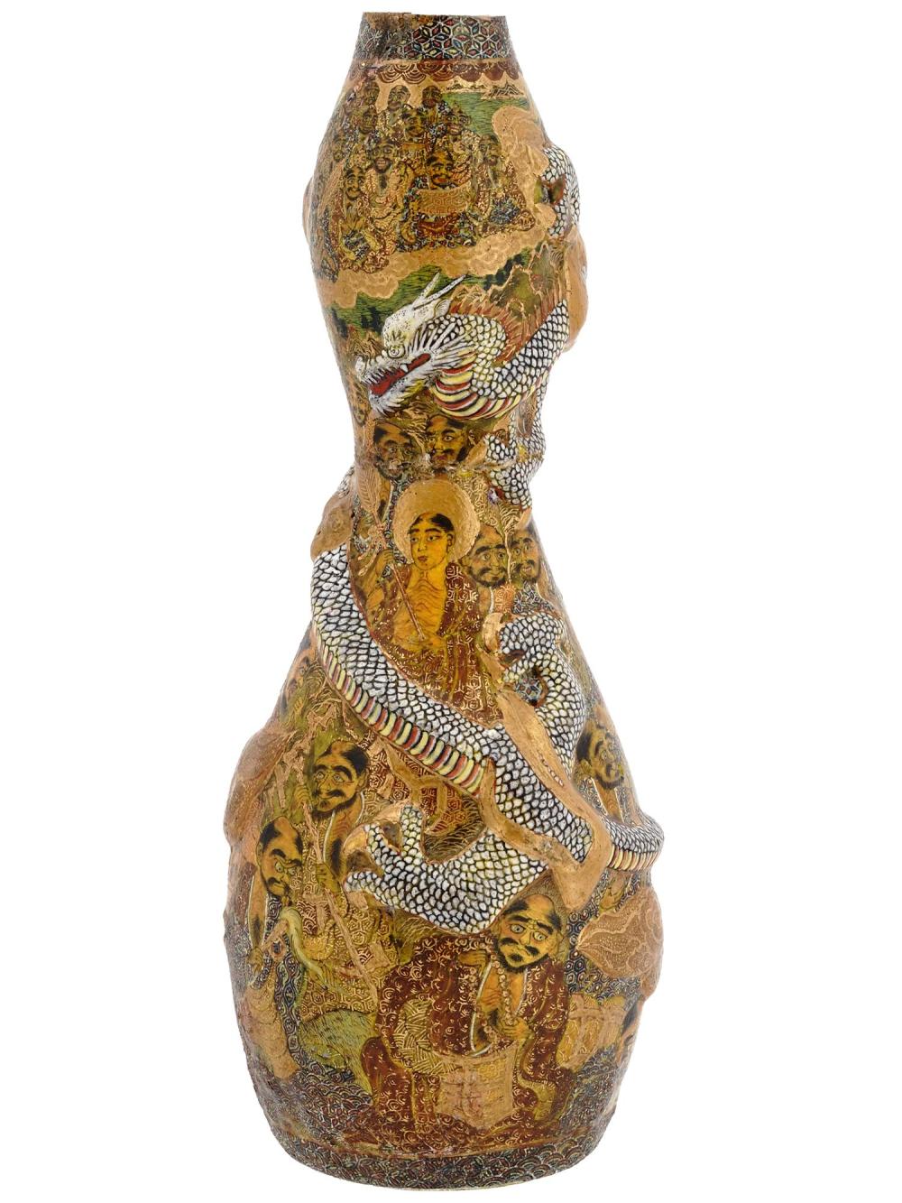 Decorative ceramic vase with colorful hand-painted figures and a large coiled dragon on the body, shown against a white background.