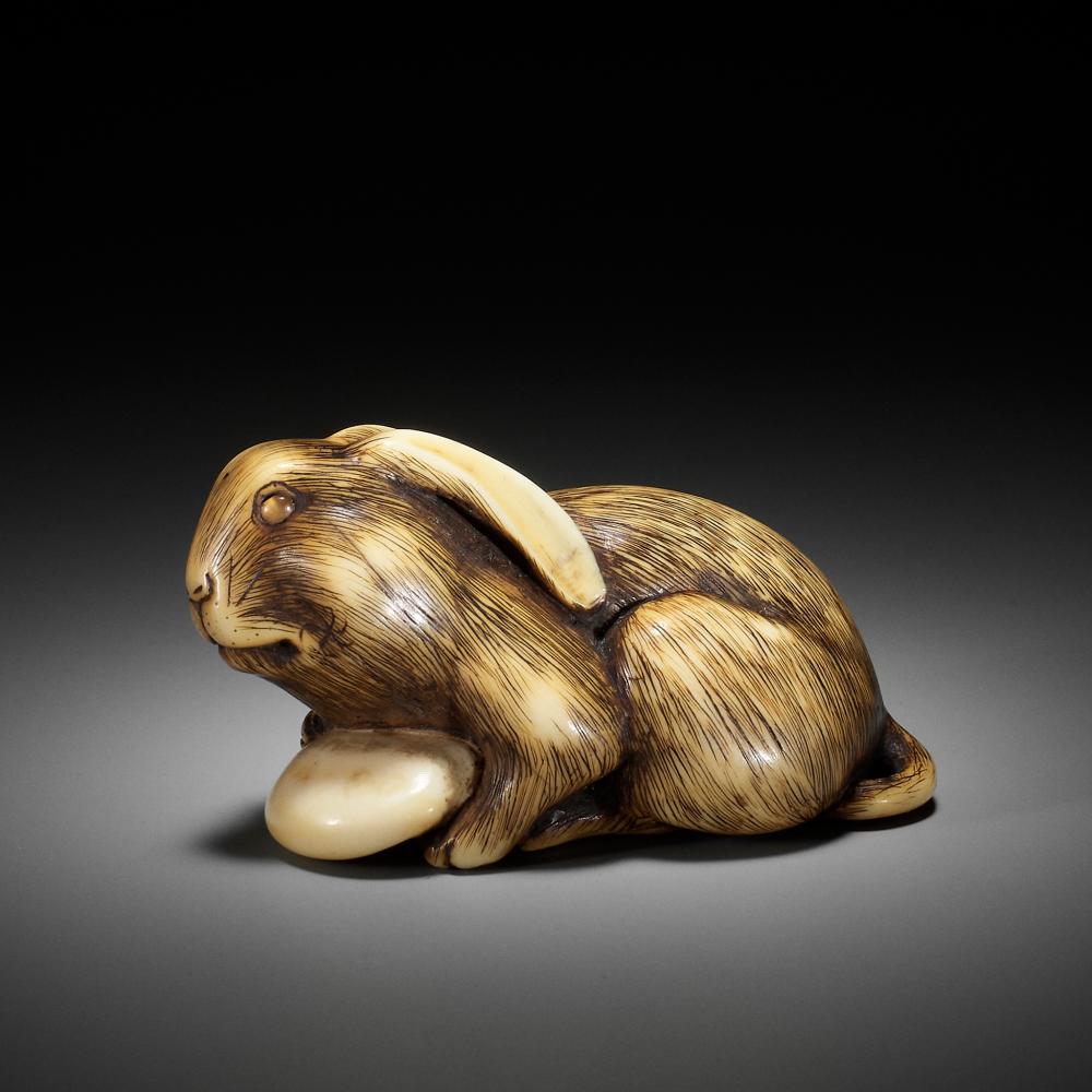 Ɏ MASATOMO: A RARE IVORY NETSUKE OF A HARE WITH MUSHROOM sold by Galerie Zacke, lot 34 — auction record photograph