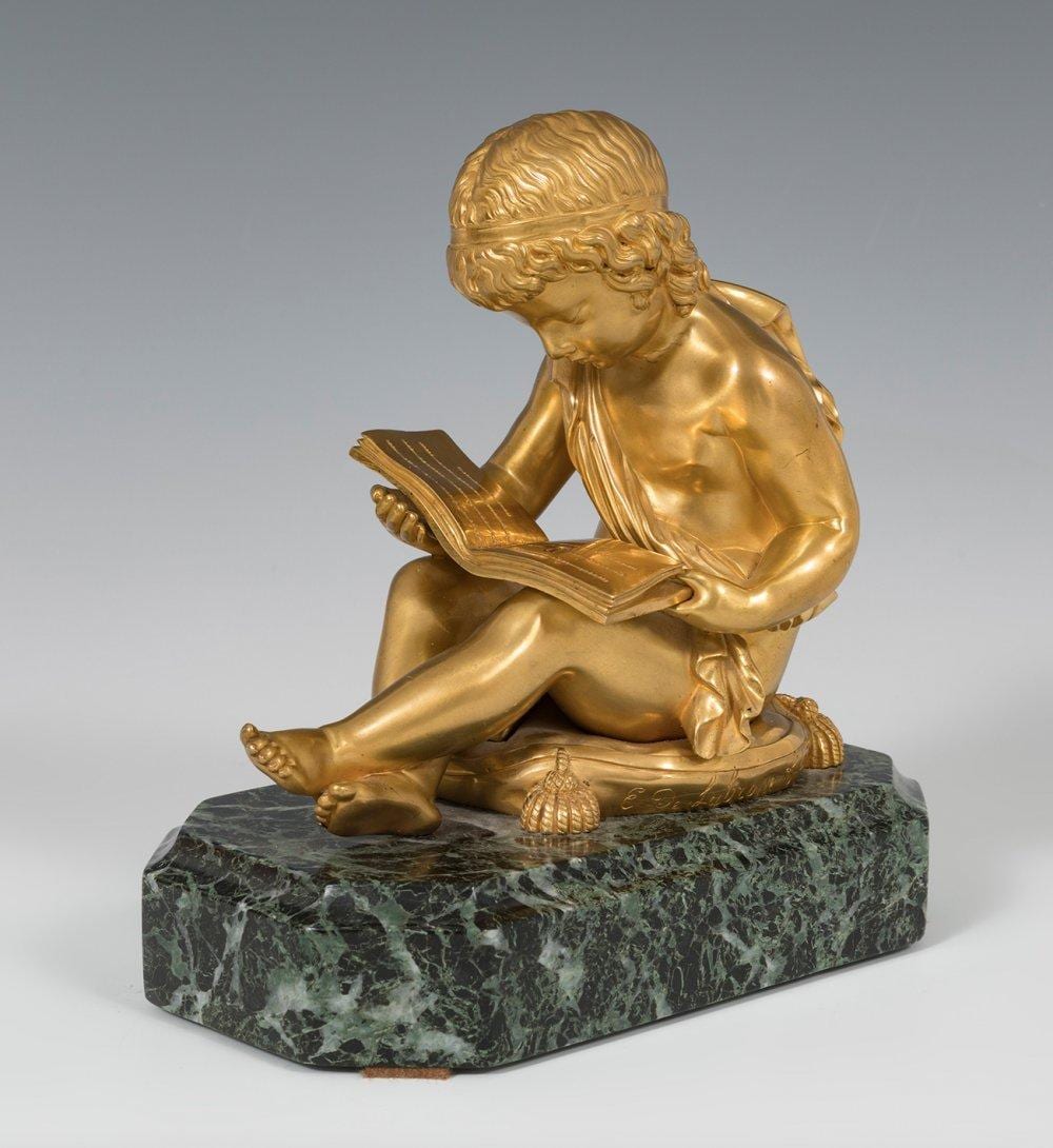Charles Gabriel Lemire comparable auction result: charles gabriel lemire lun ville 1741 par s 1827 ni o leyendo bronce dorado y m rmol firmado en un lateral del coj n medidas 21 x 19 x 11 5 cm