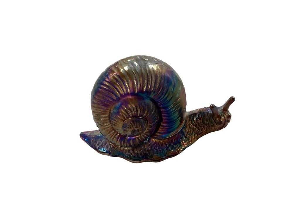 Colorful iridescent snail-shaped decorative glass figurine with spiral shell on a white background.