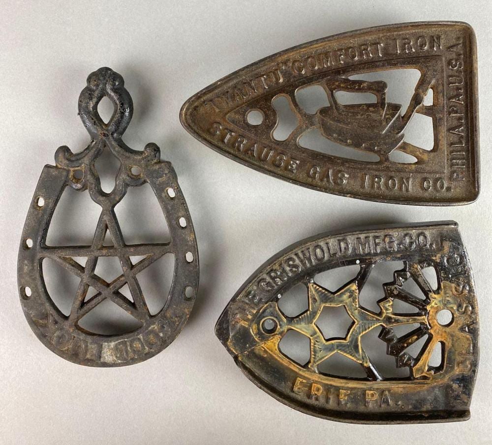 Group of 3 Cast Iron Trivets sold by Matthew Bullock Auctioneers, lot 307 — auction record photograph