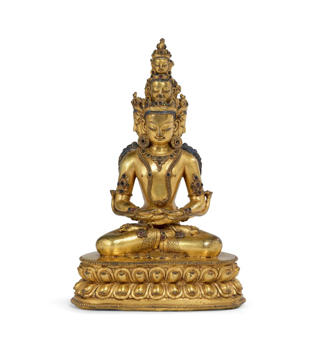 = Gilded bronze statue with hard stone inlays representing Mahavairocana seated in vajrasana on a double lotiform base, sold by Aguttes, lot 101 — auction record photograph