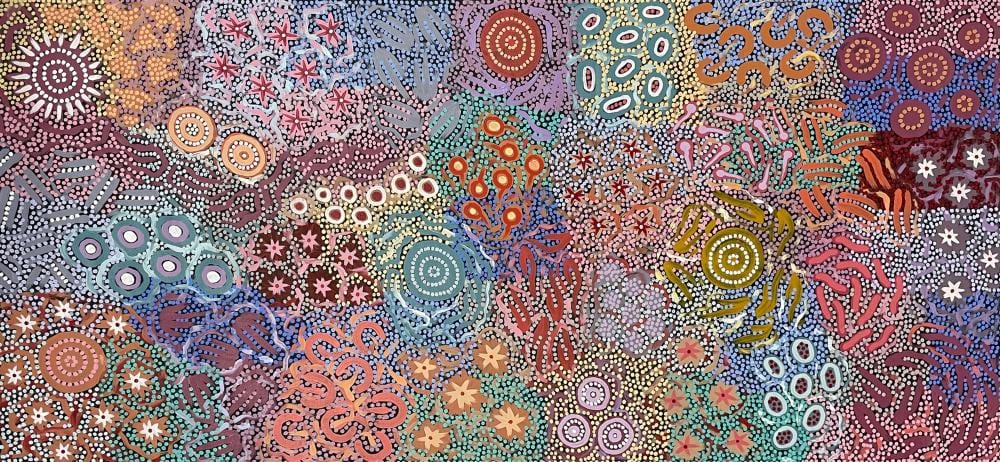 Colorful Aboriginal-style dot painting with swirling lines, star shapes, and circular motifs across a purple, blue, pink, and orange background.